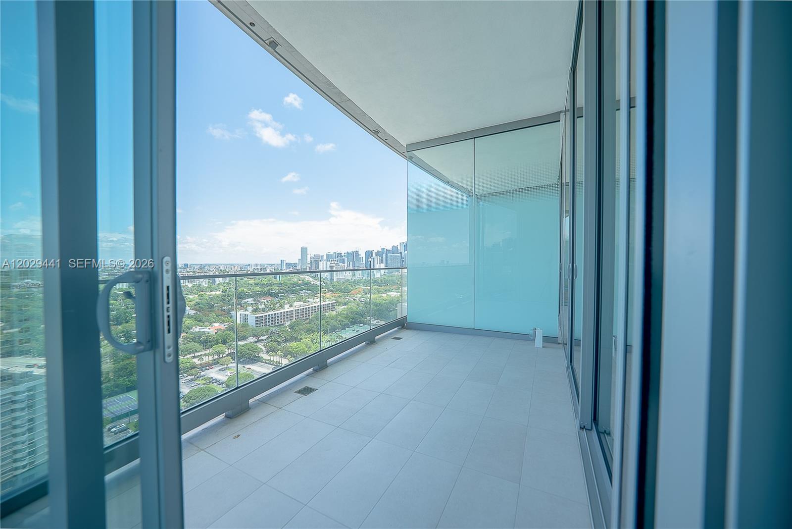 175 Southeast 25th Road, Unit 2103 Miami, FL 33129 - Photo 9 of 27 a view of a glass door and balcony