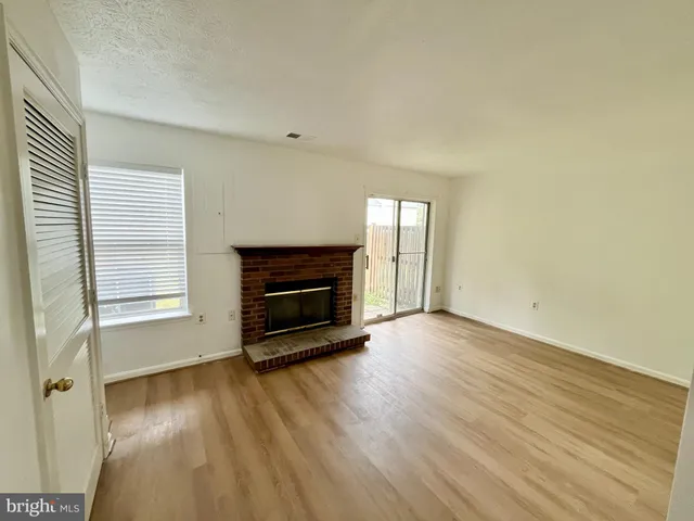 an empty room with wooden floor