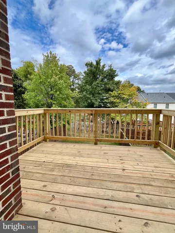 a view of wooden balcony with outdoor space