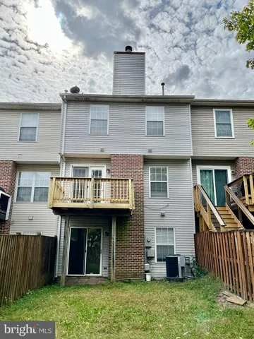 a view of a kitchen with a sink and cabinets
