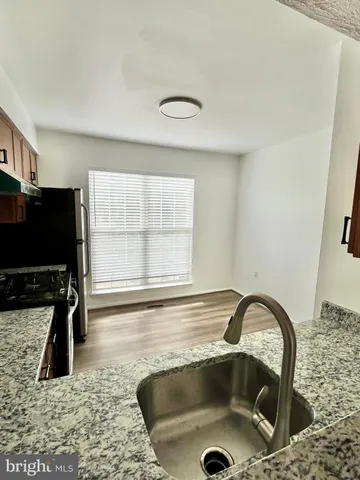 a bathroom with a sink a mirror and a bathtub