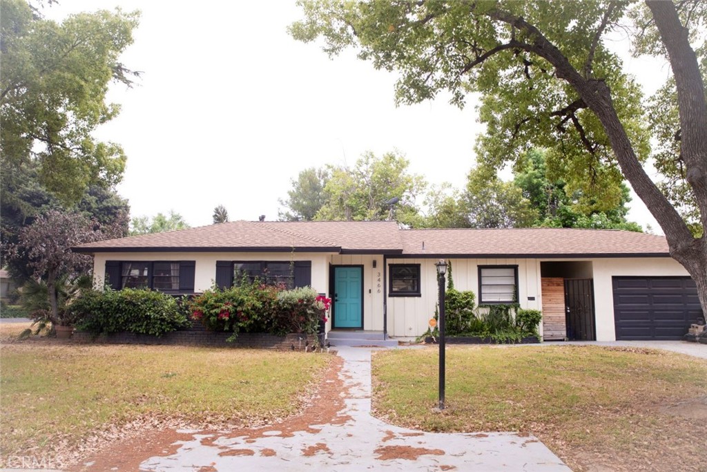 3466 Wanda Way Riverside, CA 92506 - Photo 1 of 1 a front view of a house with a garden and plants