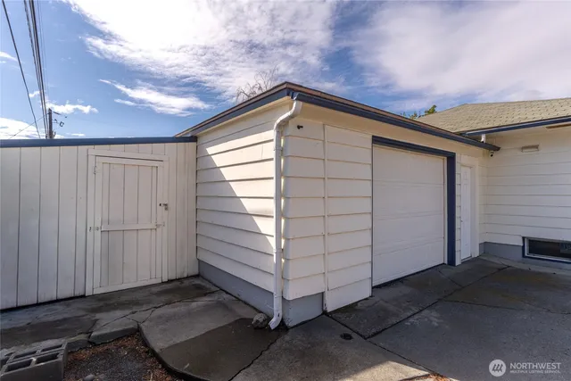 a view of a room with lots of wooden furniture