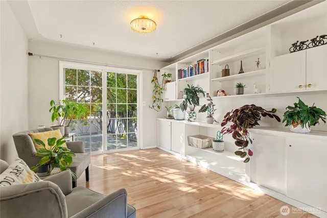 a living room with furniture and a potted plant