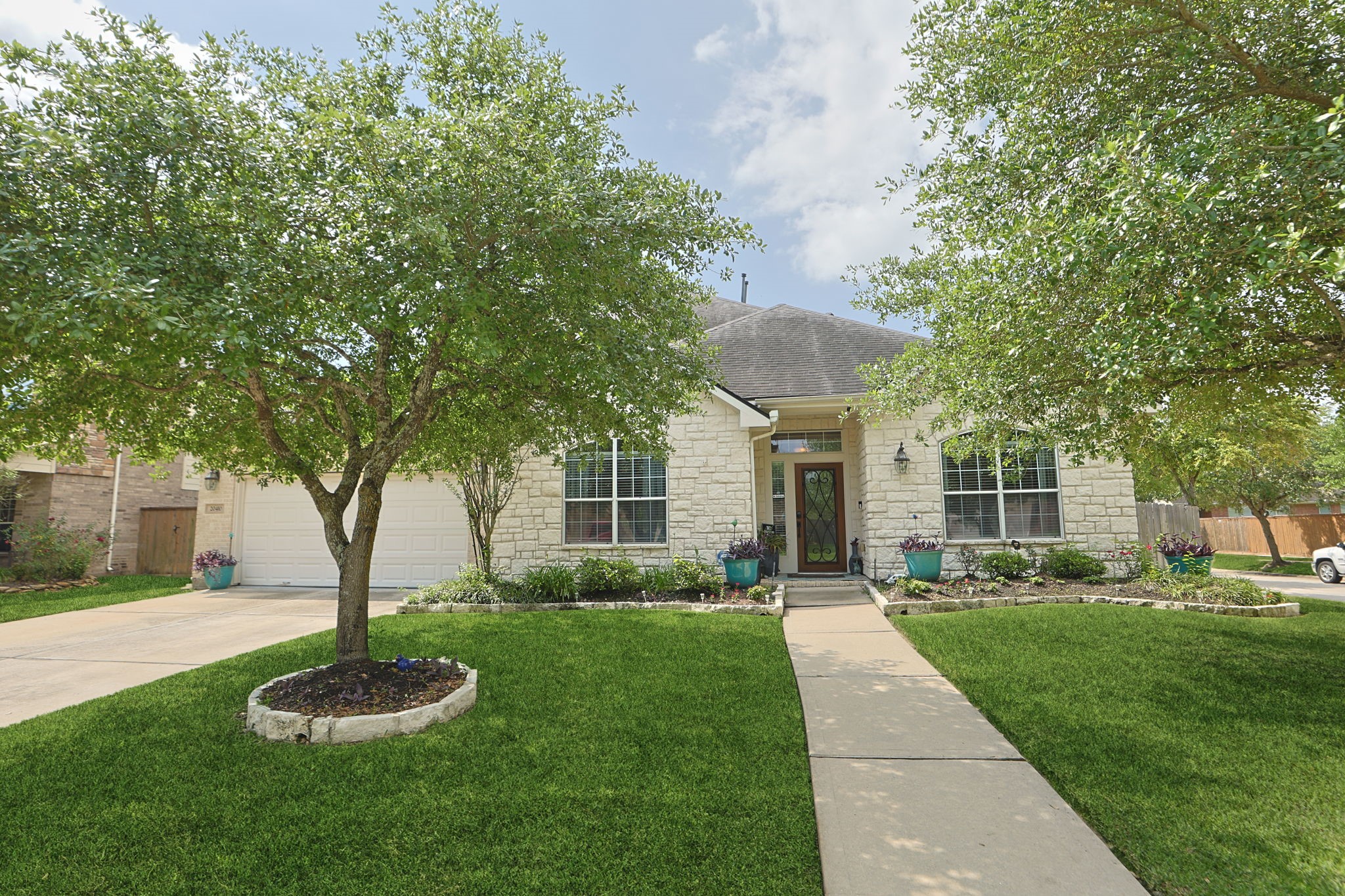 20410 Misty Crossing Lane Spring, TX 77379 - Photo 2 of 50 This stylish home has one very consistant feature. Natural light. There are large windows throughout the house. It also has style and warmth. Stop by and take a look.