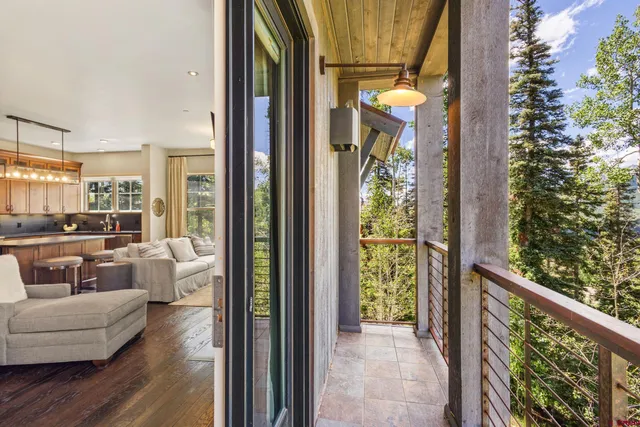 a view of a balcony filled with furniture
