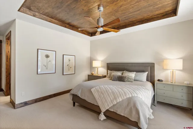 a bedroom with a bed and lamp