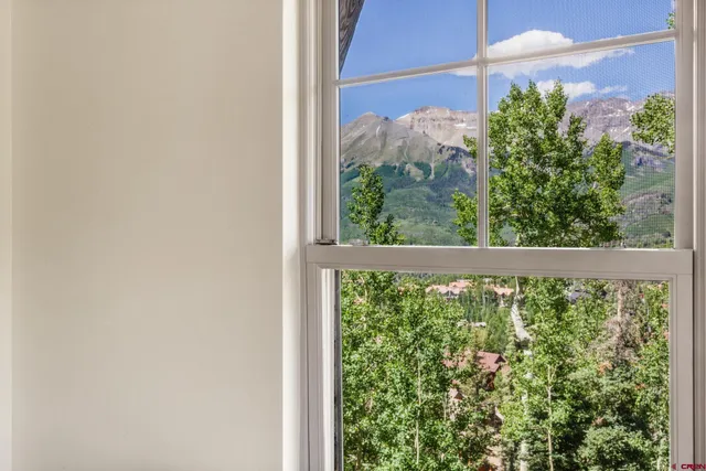 a view of a balcony with plants