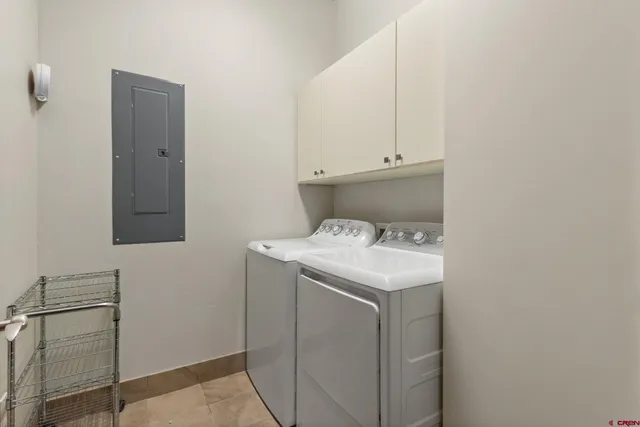a utility room with a sink dryer and washer