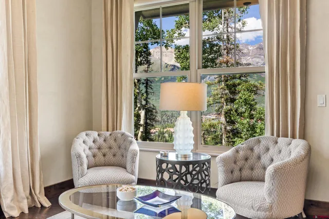 a living room with furniture and a window