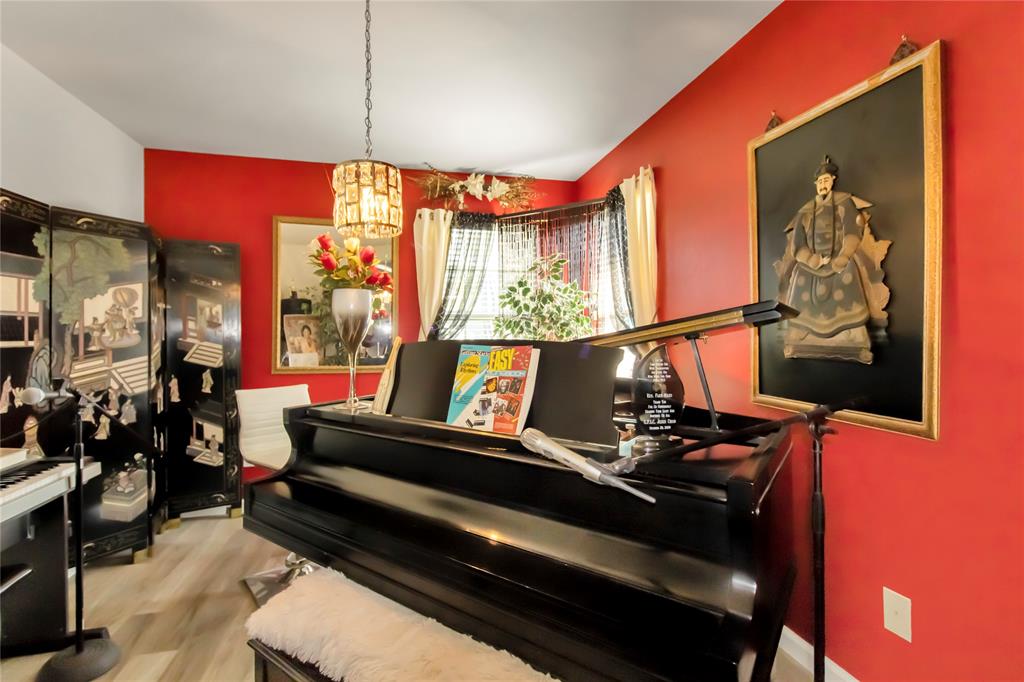 922 Hannah Way Dallas, TX 75253 - Photo 14 of 29 a living room with furniture a lamp and a large window