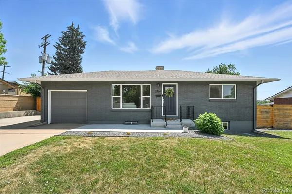 a front view of house with yard outdoor seating and barbeque oven