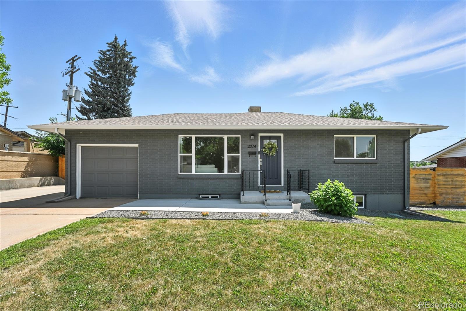 2714 South Raleigh Street Denver, CO 80236 - Photo 1 of 34 a front view of house with yard outdoor seating and barbeque oven