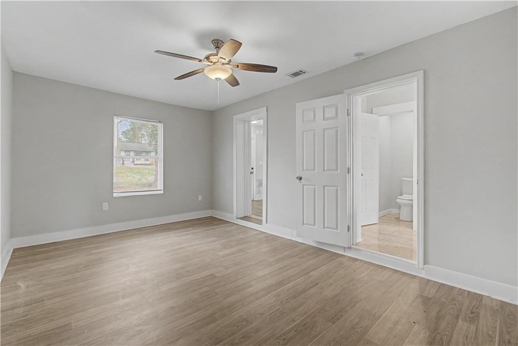 2835 Laguna Drive Decatur, GA 30032 - Photo 11 of 25 wooden floor in an empty room with a window