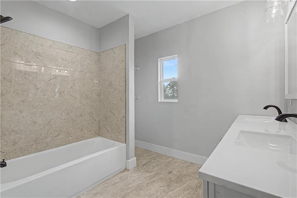 2835 Laguna Drive Decatur, GA 30032 - Photo 13 of 25 a bathroom with a bathtub and a sink