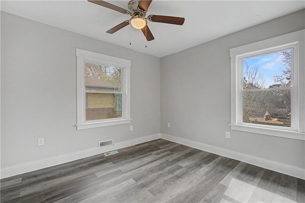 2835 Laguna Drive Decatur, GA 30032 - Photo 16 of 25 a view of an empty room with a window and a painting on the wall