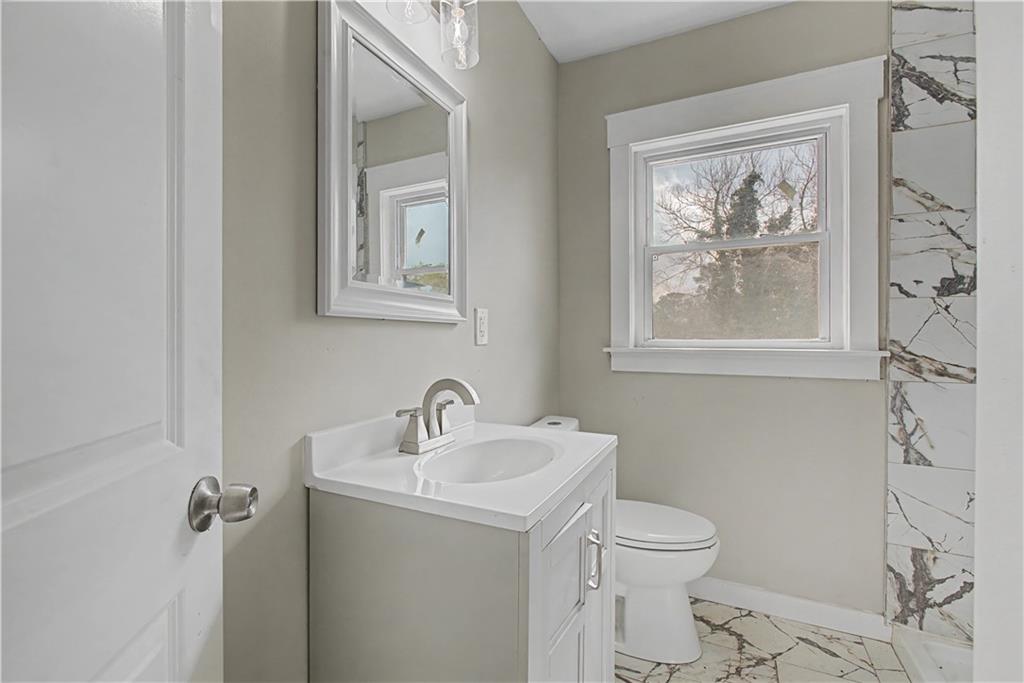 2835 Laguna Drive Decatur, GA 30032 - Photo 18 of 25 a bathroom with a toilet sink and mirror