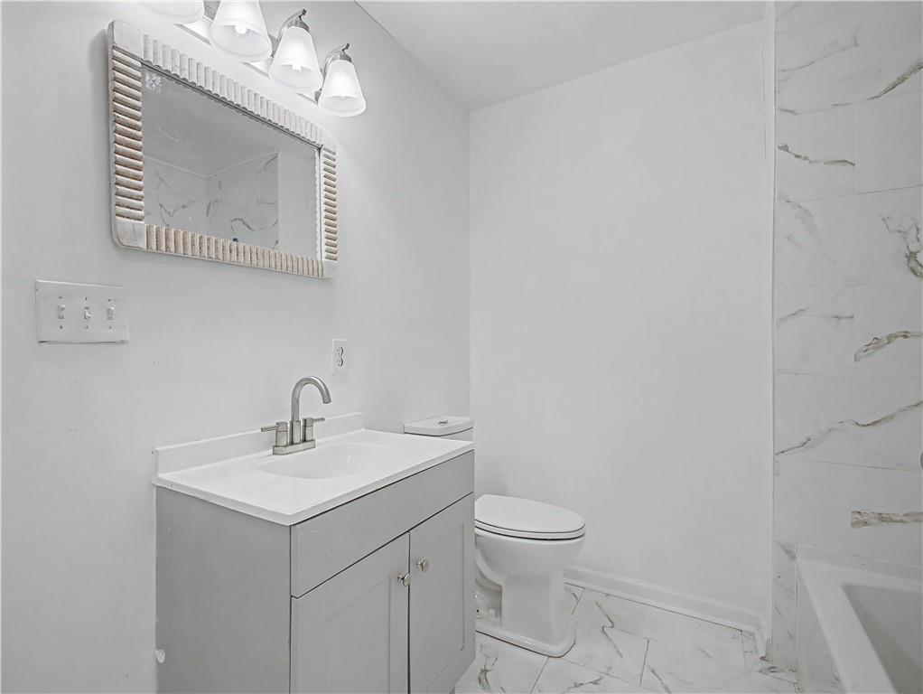 2835 Laguna Drive Decatur, GA 30032 - Photo 23 of 25 a bathroom with a sink mirror and toilet