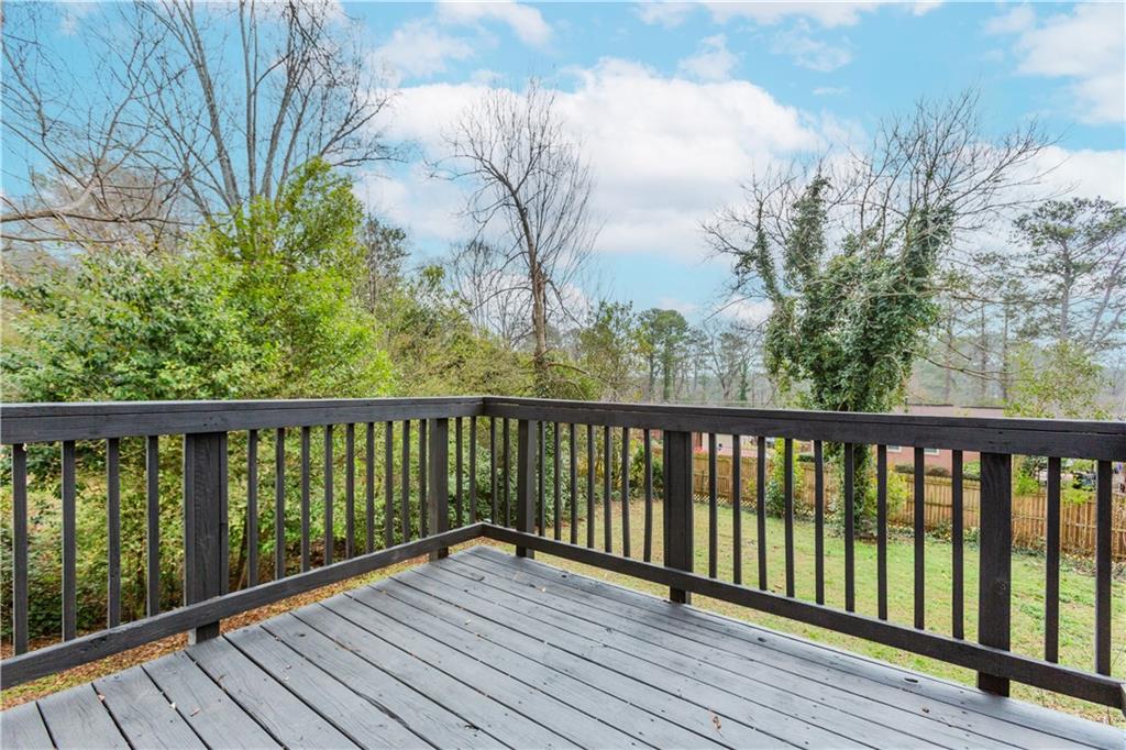 2835 Laguna Drive Decatur, GA 30032 - Photo 25 of 25 a view of balcony with wooden floor and fence