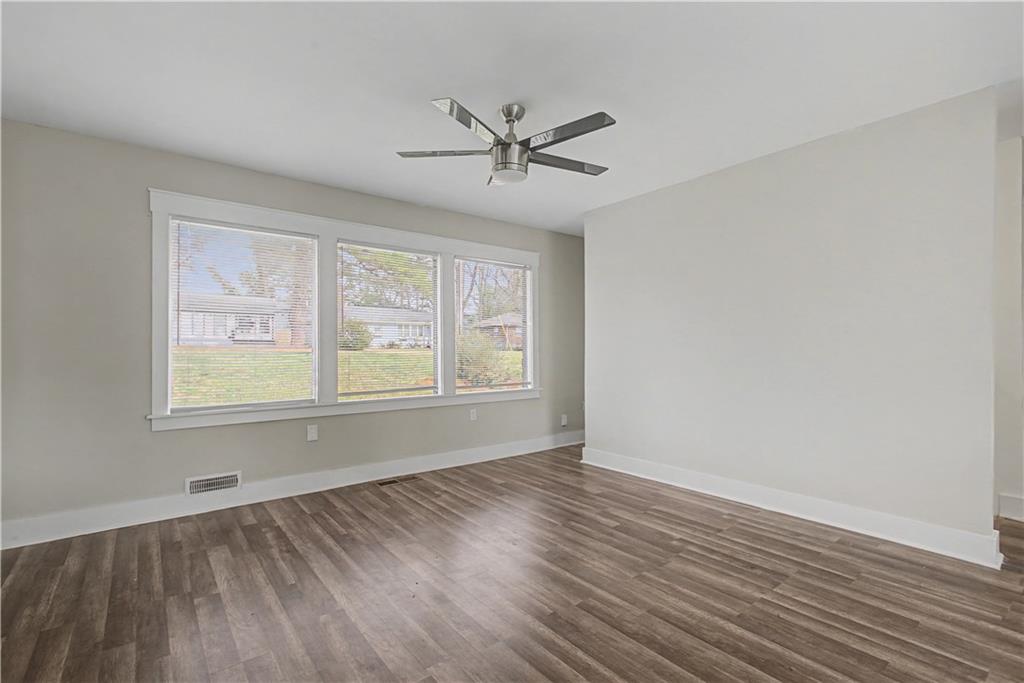 2835 Laguna Drive Decatur, GA 30032 - Photo 4 of 25 wooden floor in an empty room with a window