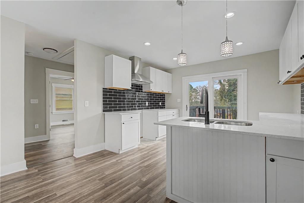 2835 Laguna Drive Decatur, GA 30032 - Photo 6 of 25 a kitchen with stainless steel appliances granite countertop a stove and cabinets