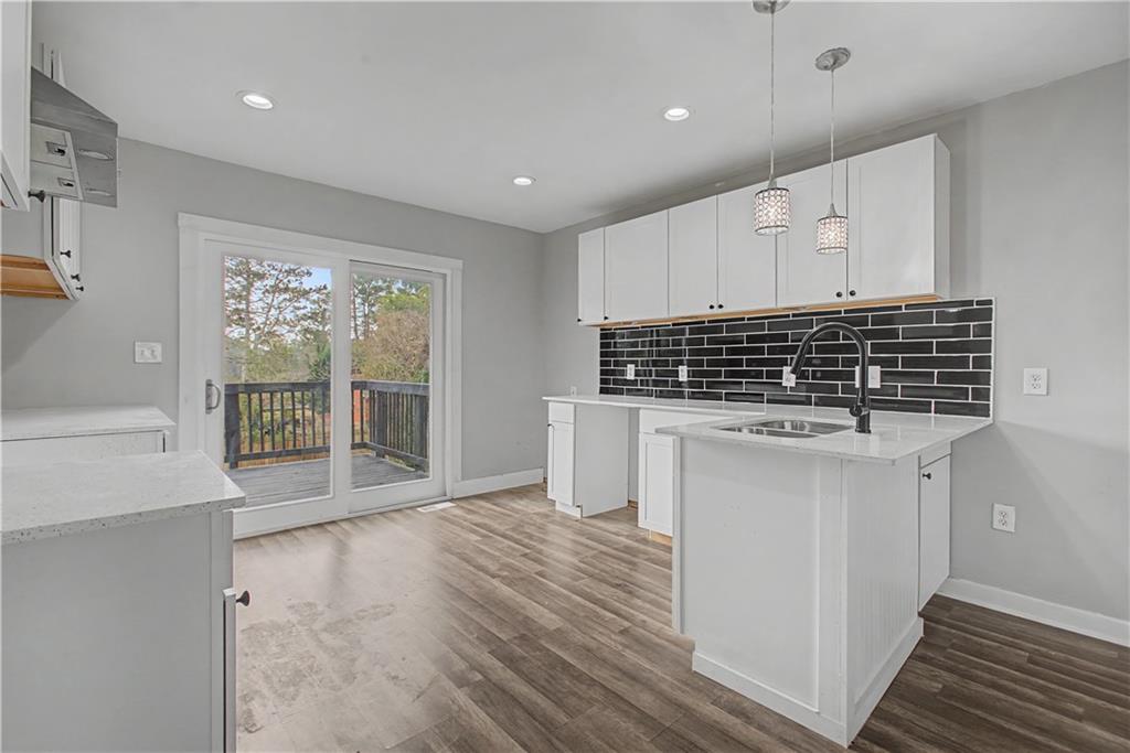 2835 Laguna Drive Decatur, GA 30032 - Photo 7 of 25 a open kitchen with white cabinets and wooden floor