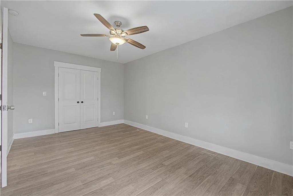 2835 Laguna Drive Decatur, GA 30032 - Photo 10 of 25 a view of an empty room with wooden floor