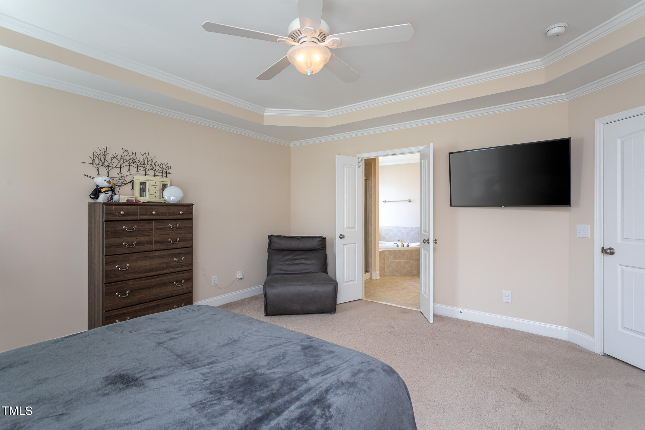 2411 Cattail Pond Drive Zebulon, NC 27597 - Photo 15 of 37 a bedroom with a bed and a television