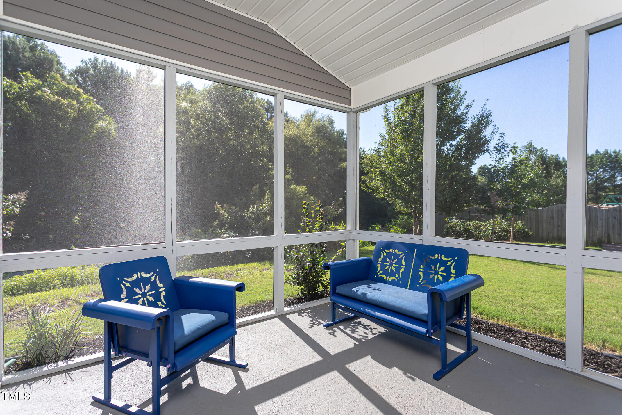 2411 Cattail Pond Drive Zebulon, NC 27597 - Photo 30 of 37 a sitting area with lake view and a couches