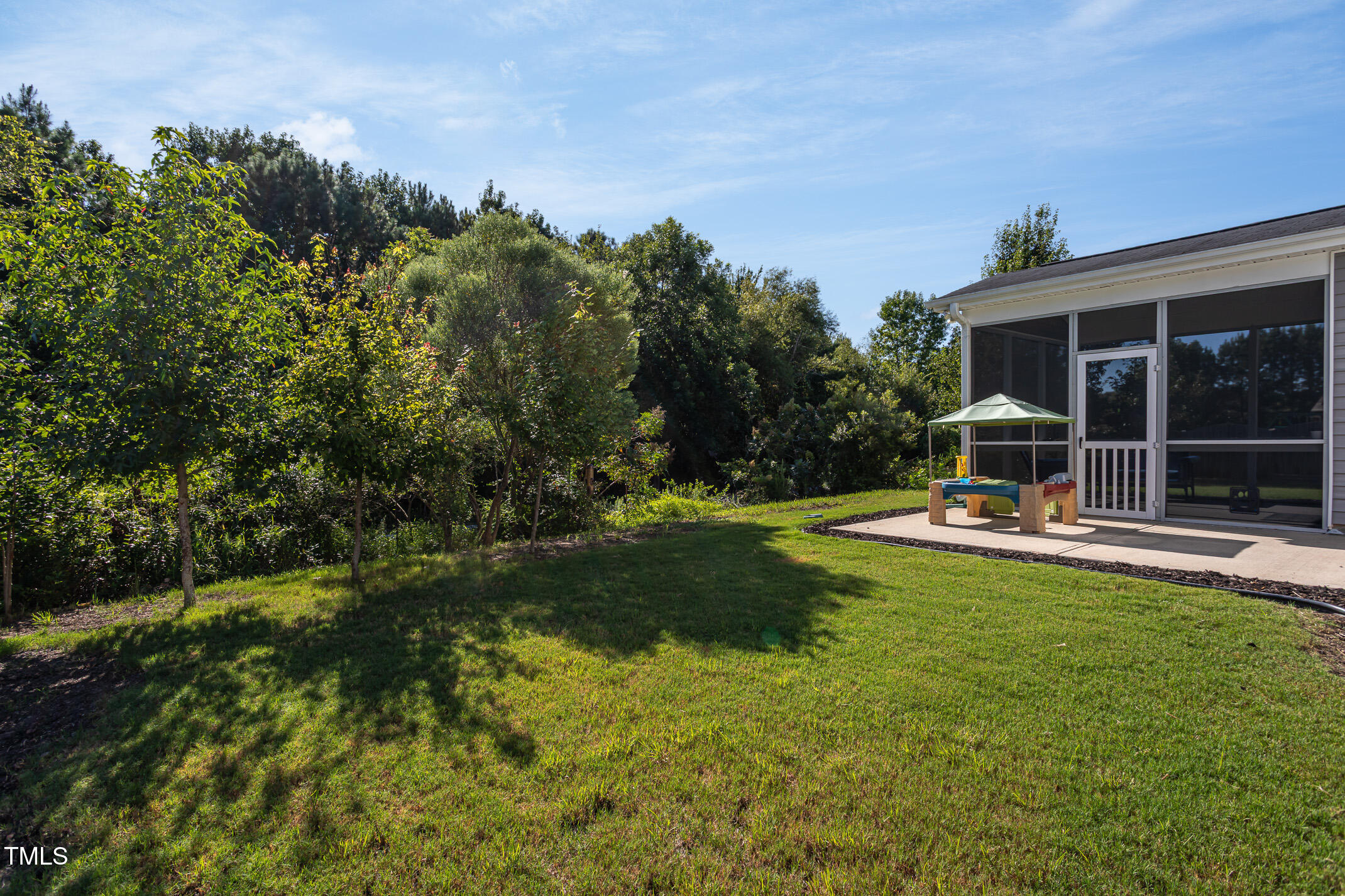 2411 Cattail Pond Drive Zebulon, NC 27597 - Photo 32 of 37 a view of a house with swimming pool and sitting area