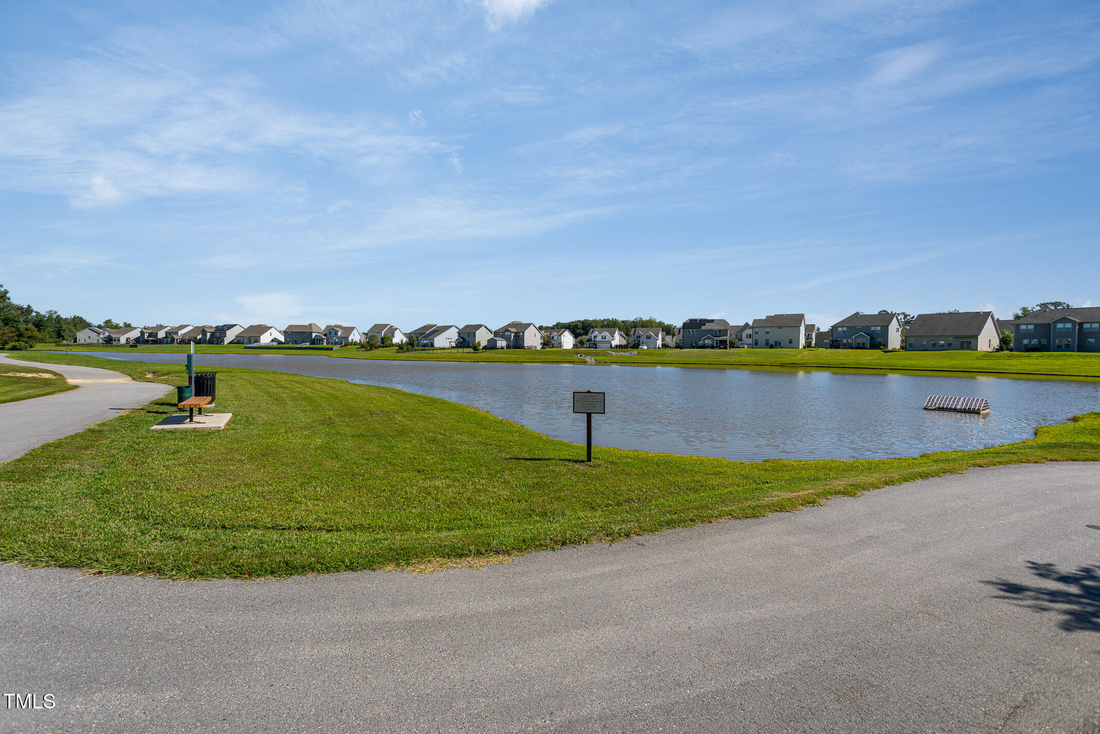2411 Cattail Pond Drive Zebulon, NC 27597 - Photo 36 of 37 a view of an ocean with beach and outdoor space