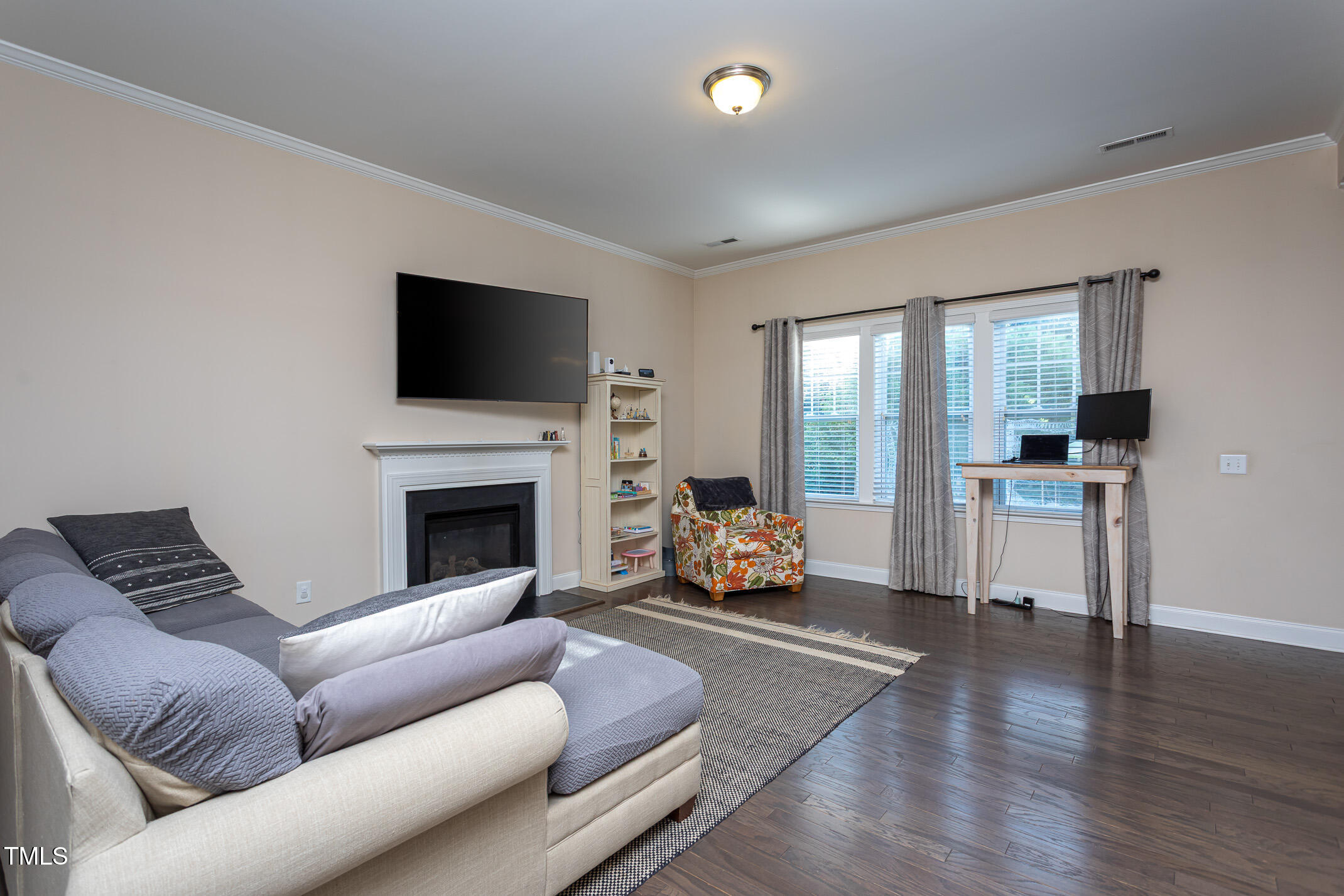 2411 Cattail Pond Drive Zebulon, NC 27597 - Photo 5 of 37 a living room with furniture and a fireplace