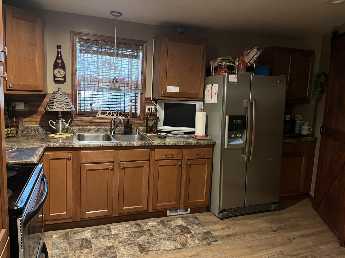 15213 Waverly Avenue Midlothian, IL 60445 - Photo 7 of 12 a kitchen with stainless steel appliances granite countertop a refrigerator and a sink