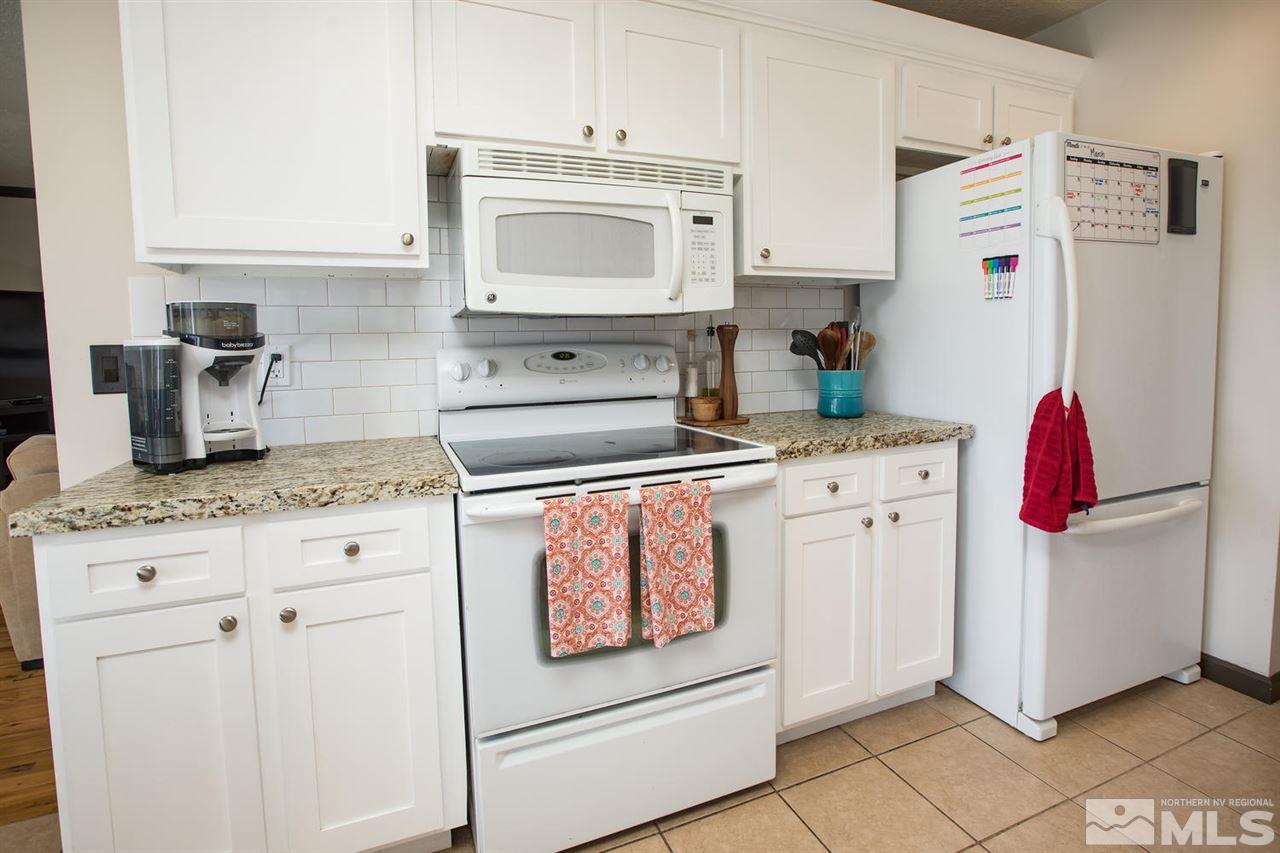 2890 Judith Lane Reno, NV 89503 - Photo 8 of 25 a kitchen with appliances a sink and cabinets