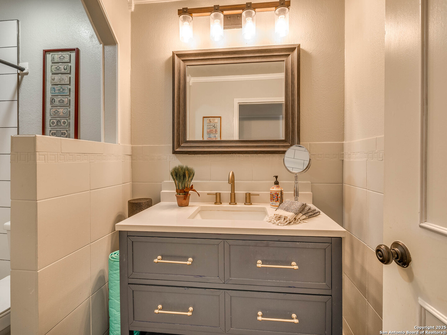 7711 Callaghan Road, Unit 702 San Antonio, TX 78229 - Photo 13 of 49 a bathroom with a sink vanity and a mirror