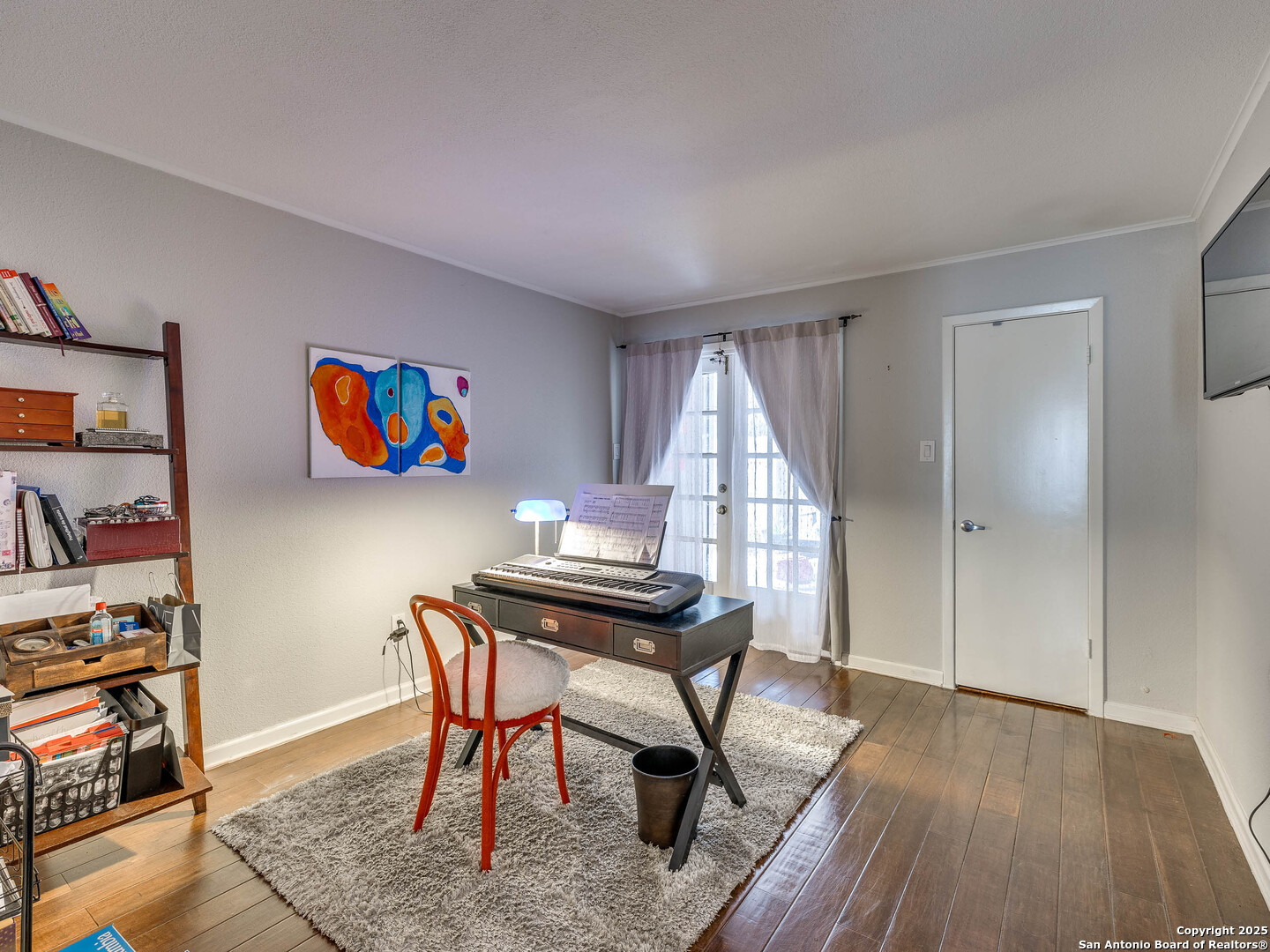 7711 Callaghan Road, Unit 702 San Antonio, TX 78229 - Photo 15 of 49 a view of a workspace with furniture and wooden floor