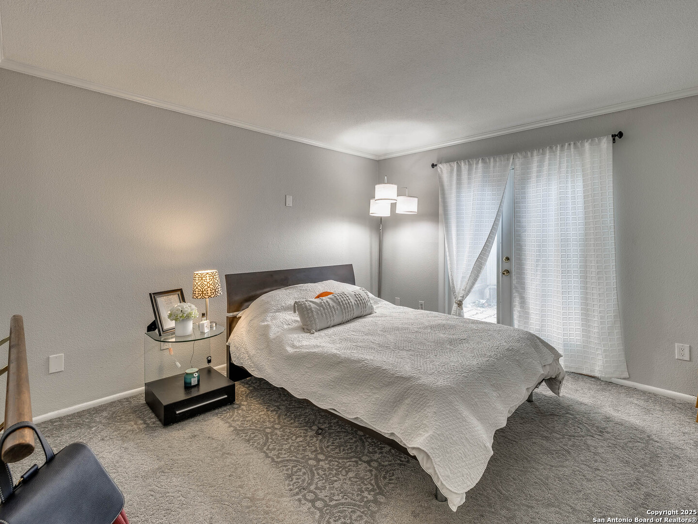 7711 Callaghan Road, Unit 702 San Antonio, TX 78229 - Photo 17 of 49 a bedroom with a bed and a window
