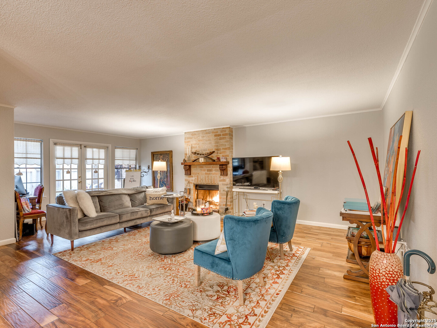 7711 Callaghan Road, Unit 702 San Antonio, TX 78229 - Photo 20 of 49 a living room with furniture a rug and a chandelier