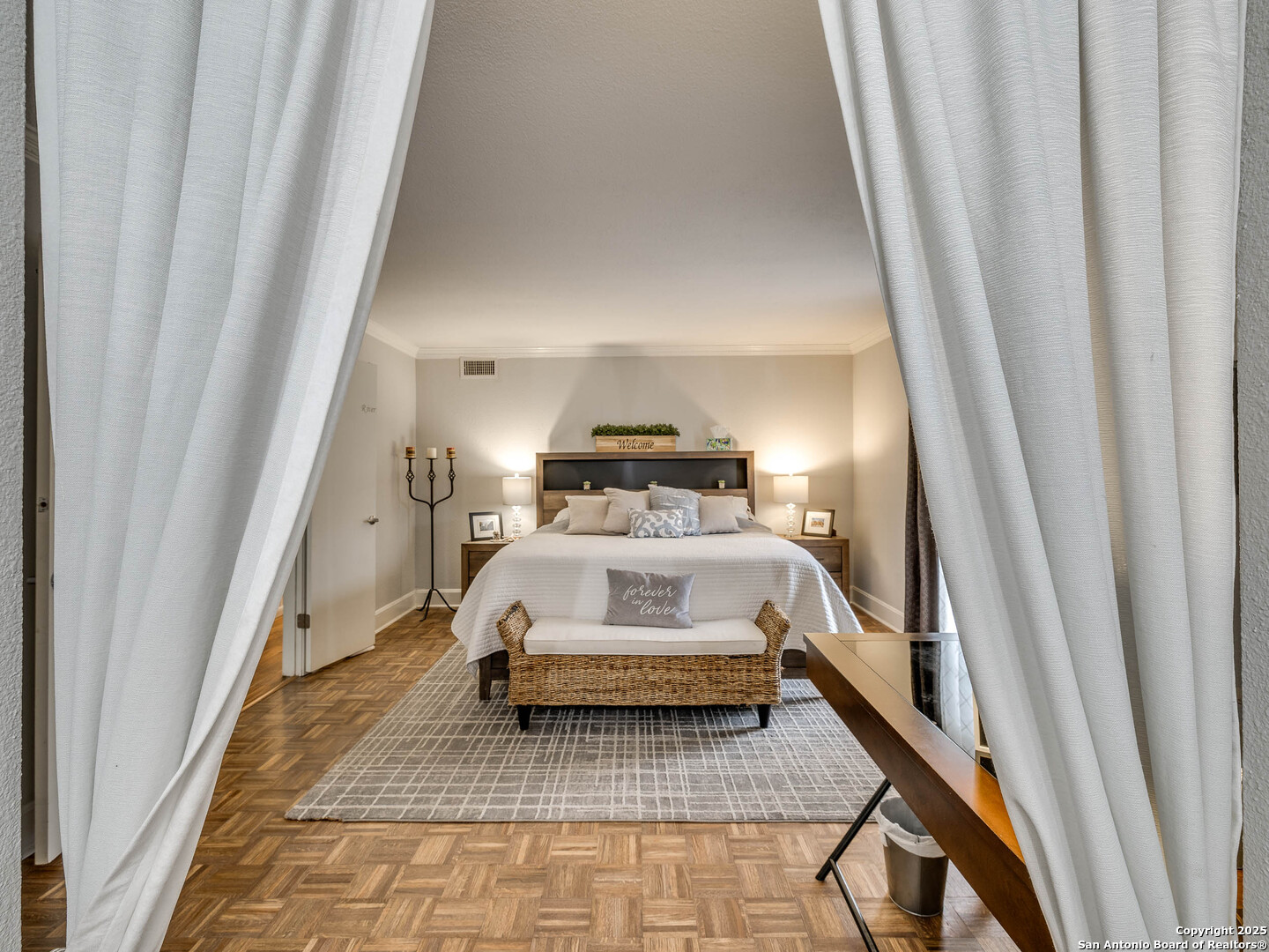 7711 Callaghan Road, Unit 702 San Antonio, TX 78229 - Photo 2 of 49 a bedroom with a bed and a rug