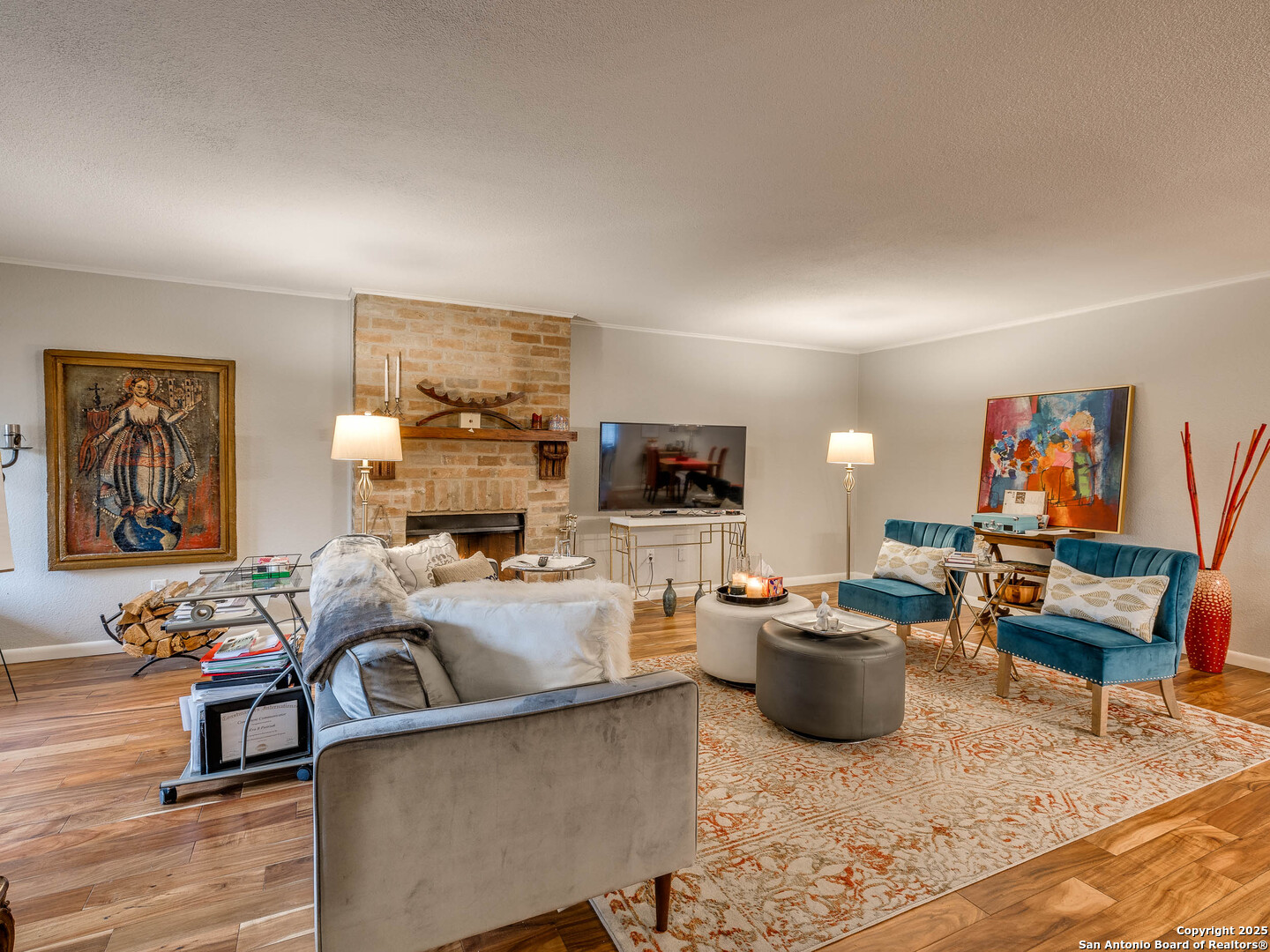 7711 Callaghan Road, Unit 702 San Antonio, TX 78229 - Photo 21 of 49 a living room with furniture a flat screen tv and a window