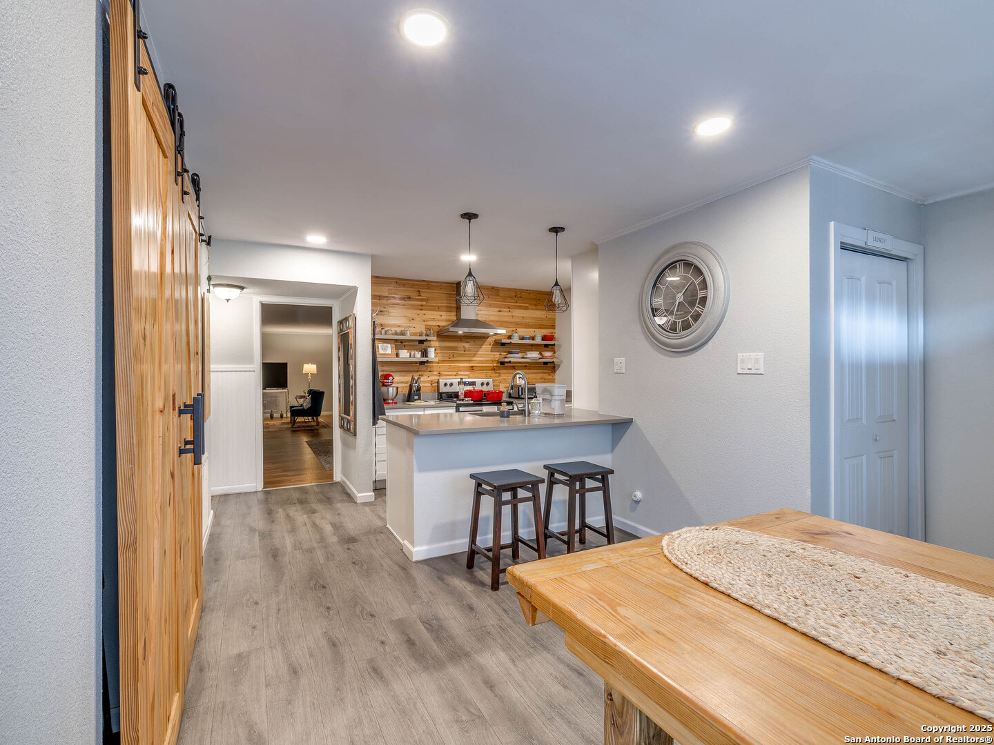 7711 Callaghan Road, Unit 702 San Antonio, TX 78229 - Photo 23 of 49 a open kitchen with a table and chairs
