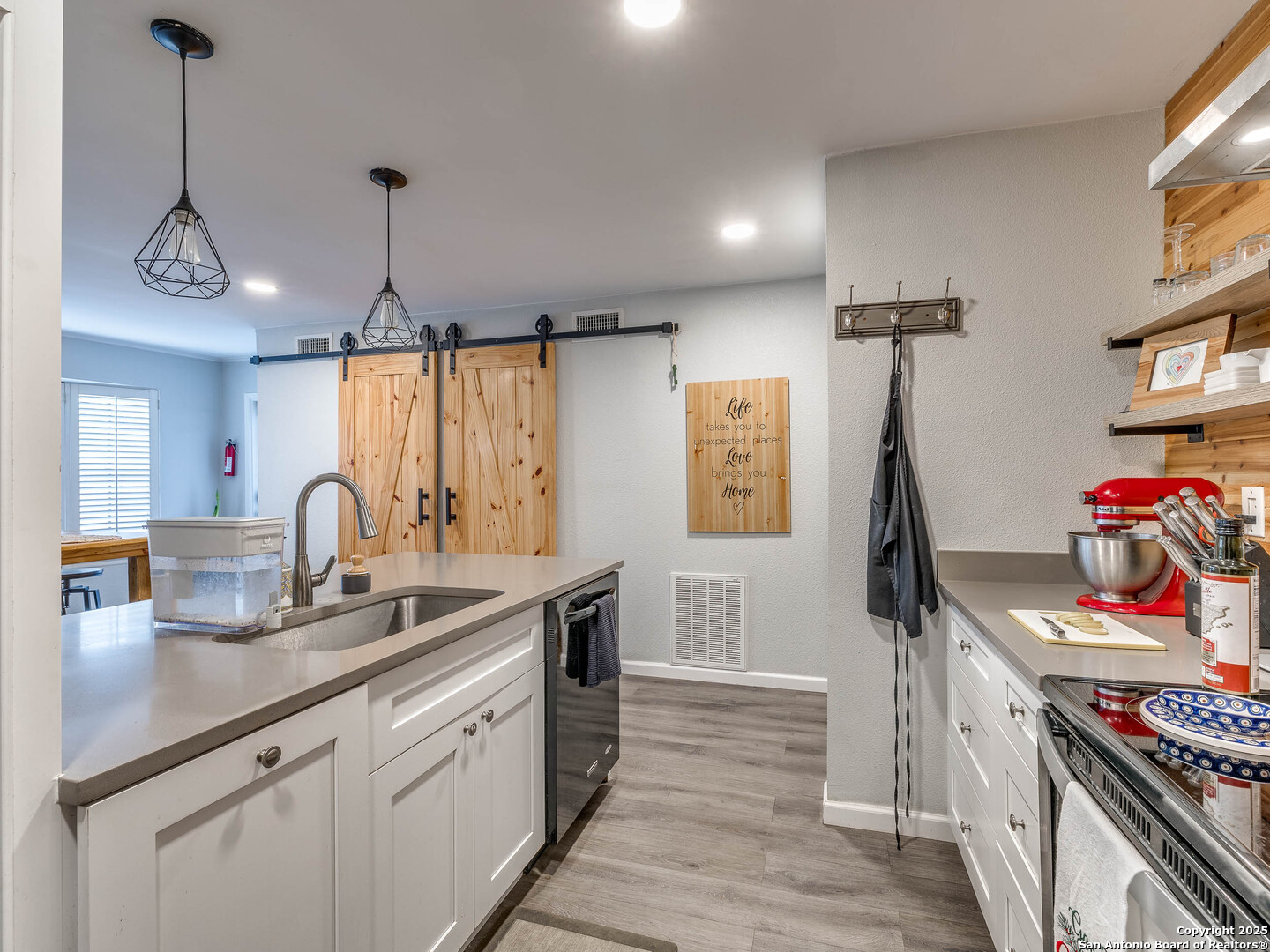 7711 Callaghan Road, Unit 702 San Antonio, TX 78229 - Photo 24 of 49 a kitchen with stainless steel appliances granite countertop a stove and a sink
