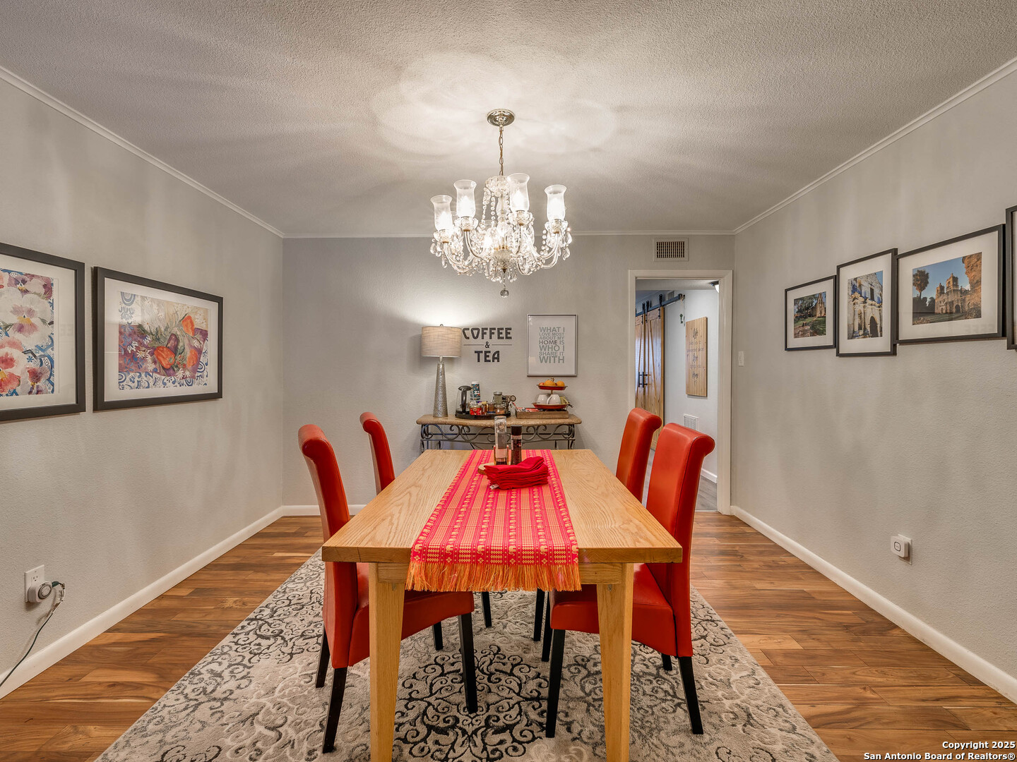 7711 Callaghan Road, Unit 702 San Antonio, TX 78229 - Photo 30 of 49 a view of a dining room with furniture and chandelier