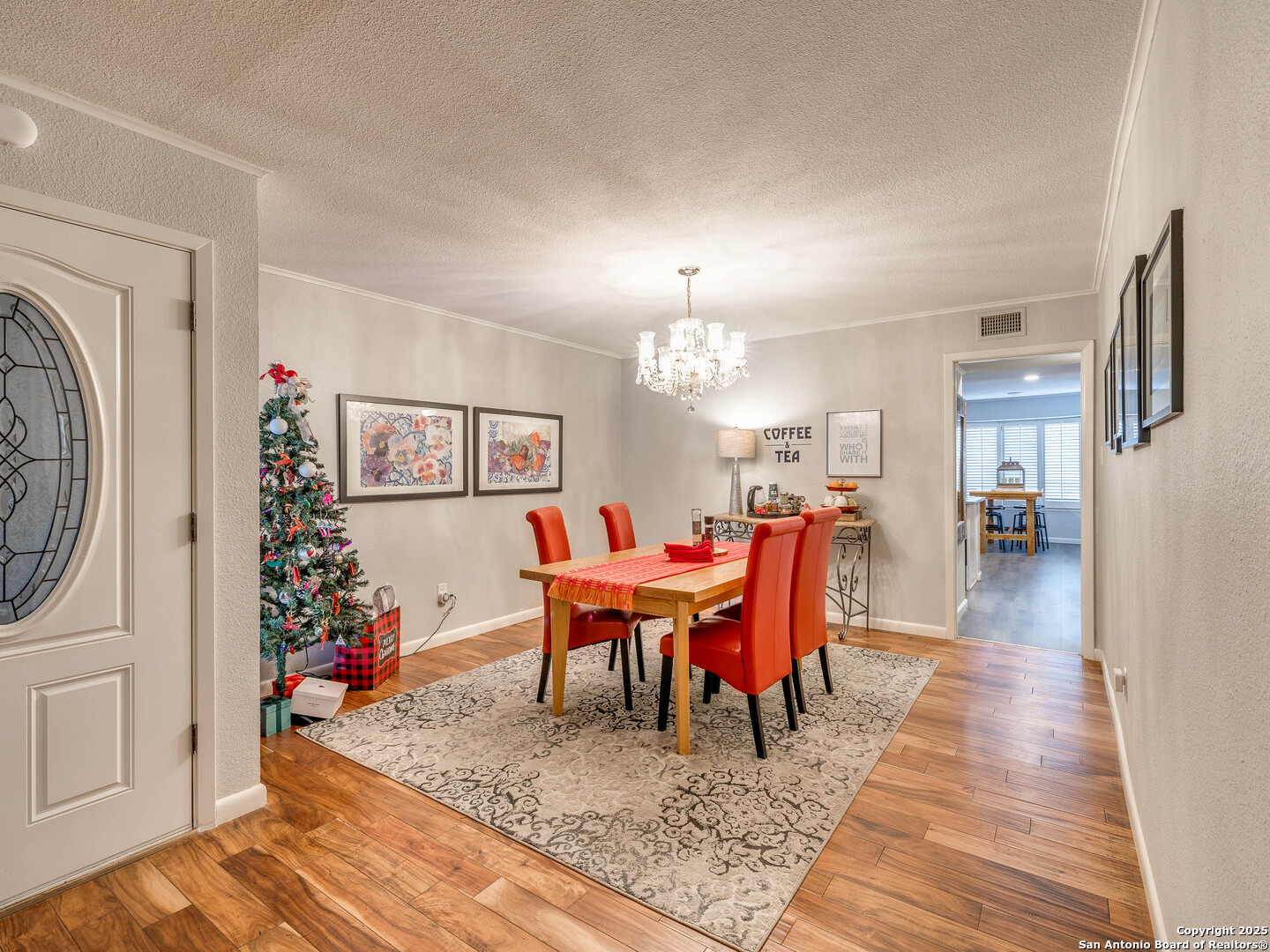 7711 Callaghan Road, Unit 702 San Antonio, TX 78229 - Photo 31 of 49 a dining room with furniture a rug and wooden floor