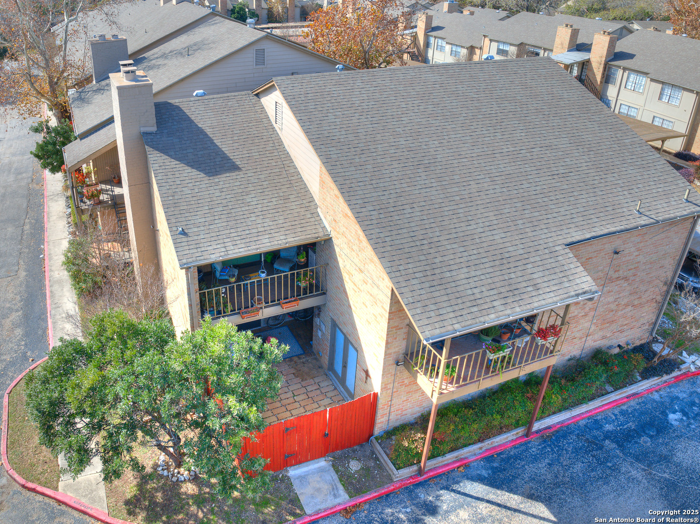 7711 Callaghan Road, Unit 702 San Antonio, TX 78229 - Photo 43 of 49 an aerial view of multiple houses with yard