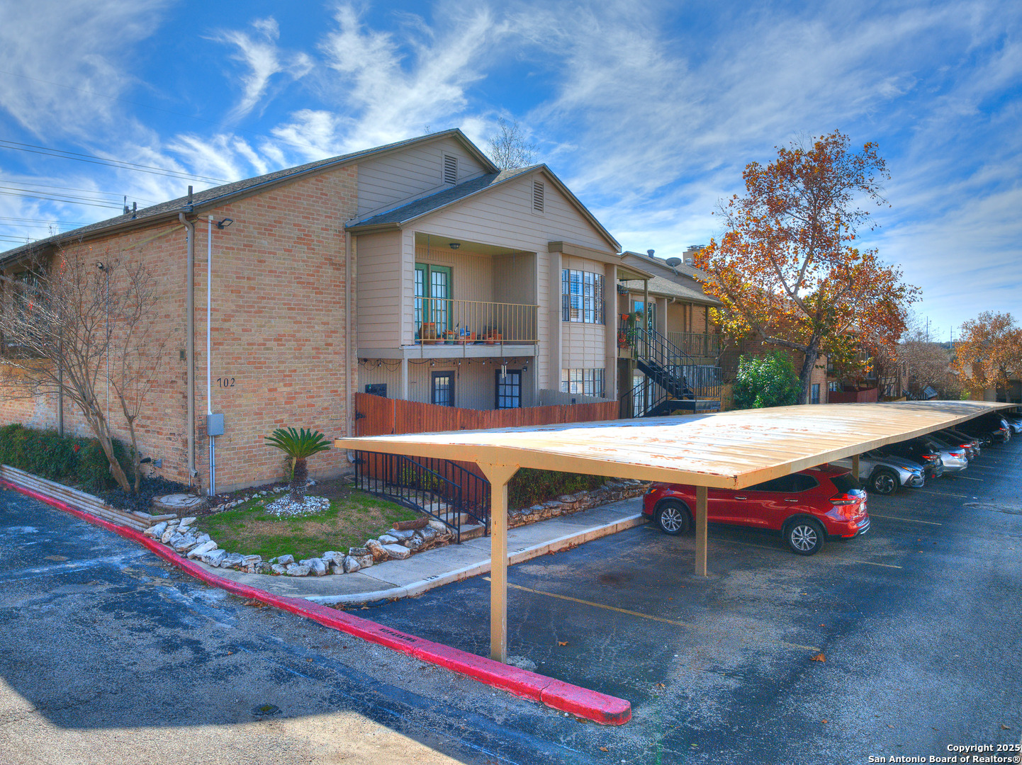7711 Callaghan Road, Unit 702 San Antonio, TX 78229 - Photo 44 of 49 a backyard of a house with table and chairs