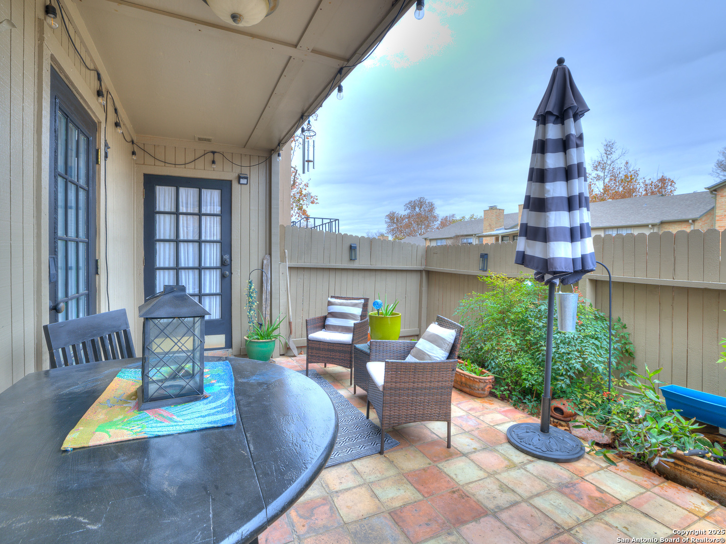 7711 Callaghan Road, Unit 702 San Antonio, TX 78229 - Photo 47 of 49 a view of a patio with couches table and chairs and potted plants