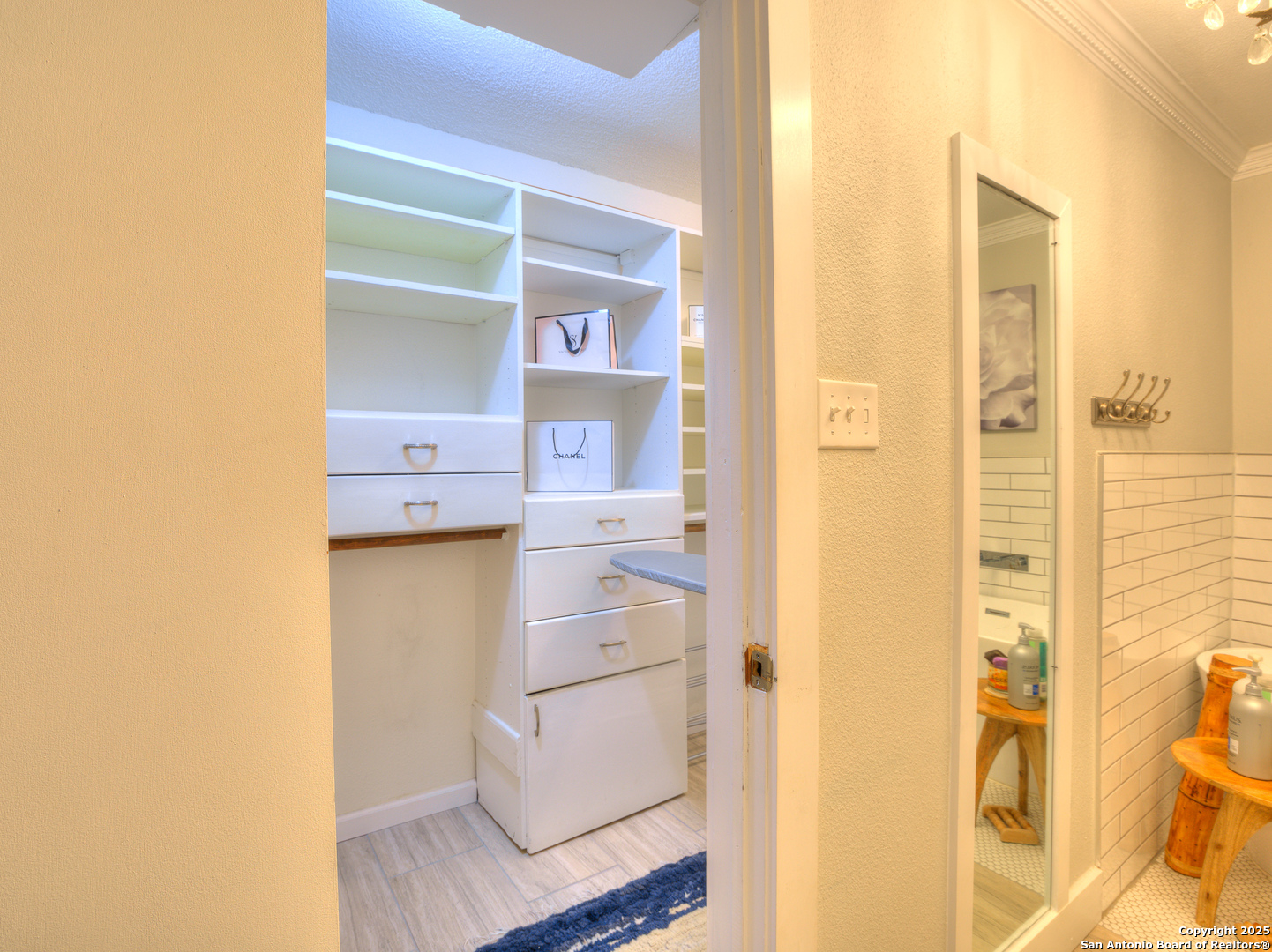 7711 Callaghan Road, Unit 702 San Antonio, TX 78229 - Photo 9 of 49 a view of walk in closet with window