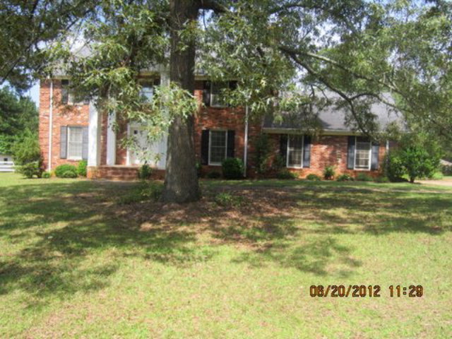 1083 Lee King Road Forsyth, GA 31029 - Photo 1 of 1 a house view with a garden space