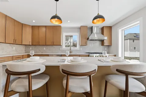 a kitchen with a dining table and chairs